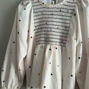 Chic Cream Blouse with Black Heart Pattern